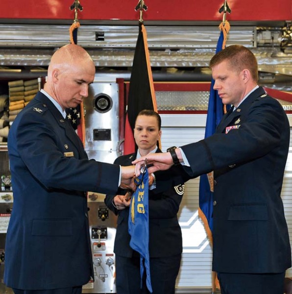 Col. Scott Warner, 86th Civil Engineer Group commander, assists Lt. Col. Robert Grover, 886th Civil Engineer Squadron commander, with retiring the flag of the 886th CES during an inactivation ceremony June 5 on Ramstein. The inactivation was necessary to reorganize and enhance efficiencies and allow the Air Force to better apply limited resources through smarter requirement prioritization.
