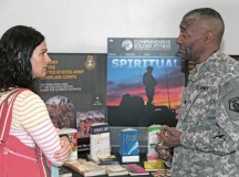 Amanda Reuter (left) speaks with Spc. Miguel Ramos, chaplain’s assistant with the 7th Civil Support Command, about the possibility of becoming a chaplain’s assistant in the Army when the 7th CSC hosted the U.S. Army Reserve birthday celebration April 23 at the Kaiserslautern Military Community Center food court.