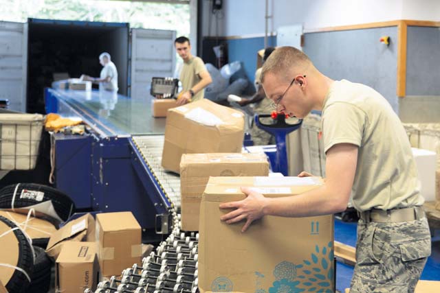 Senior Airman Colin Forney, 86th Communications Squadron postal specialist, sorts packages Sept. 9 at the Ramstein Northside Post Office.