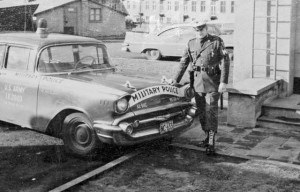 Courtesy photoJohn Mace stands next to a military police vehicle during his time in the Army.