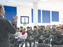 Capt. Brett Polage, 37th Airlift Squadron pilot, briefs students from the local high school in Poland about flying and life as a pilot in the U.S. Air Force 
during a theater security cooperation event Oct. 22 at Powidz Air Transport Base, Poland. The students from the high school are the equivalent to the U.S. Air Force’s Junior Reserve Officers’ Training Corps.