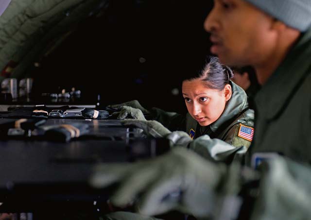 Photo by Senior Airman Jonathan StefankoStaff Sgt. Mariana Hopper, 86th Aeromedical Evacuation Squadron technician, builds a rack in the cargo bay during training Jan. 23, 2014, on Ramstein. The training provided an opportunity for AES Airmen to become more comfortable with assembling their medical equipment in various airframes.