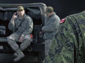Firefighters with the U.S. Air Force and Royal Canadian Air Force debrief after a simulated fire March 8 on Ramstein.