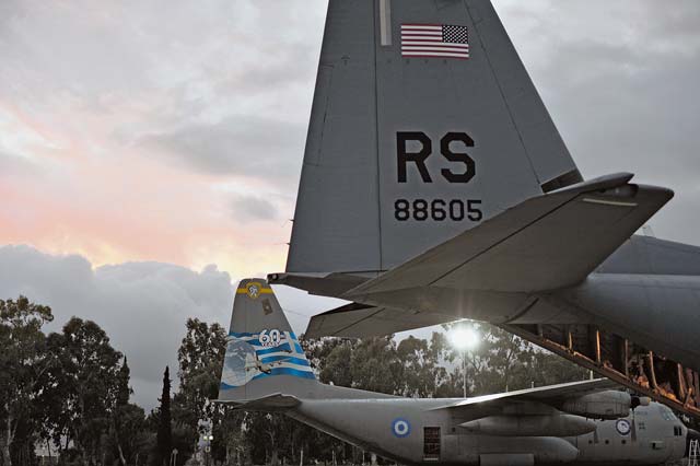 Photo by Staff Sgt. Kris LevasseurA C-130J Super Hercules sits in a parking spot in front of a Greek C-130H Hercules Feb. 2 to 14, 2014, during Stolen Cerberus, a two-week flying training deployment designed to incorporate various training methods in order to maintain proficiency during deployed operations and increase interoperability with the Hellenic air force. The mission provided the U.S. and Hellenic air forces with a unique opportunity to learn how each service performs airlift operations, improving the joint capabilities of both nations. 