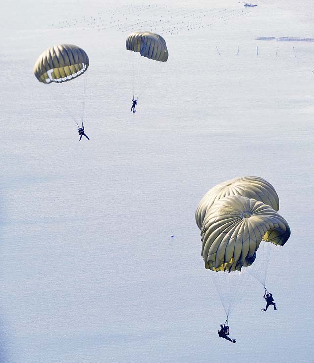 Photo by Staff Sgt. Kris LevasseurGreek paratroopers prepare for a water landing after jumping out the back of a U.S. Air Force C-130J Super Hercules Feb. 2 to 14, 2014, during Stolen Cerberus, a flight training deployment.