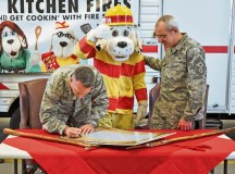 Photo by Airman 1st Class Michael StuartBrig. Gen. Patrick X. Mordente (left), 86th Airlift Wing commander, and Chief Master Sgt. James Morris, 86th AW command chief, sign the 2013 Fire Prevention Week Proclamation Oct. 4 on Ramstein. This year’s theme of Fire Prevention Week is to stress the dangers of kitchen fires.