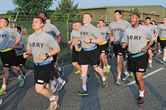 Photo by Brandon BeachSoldiers from the 21st Theater Sustainment Command participate in an early morning run June 12 on Rhine Ordnance Barracks in celebration of the 239th Army birthday. An official cake-cutting ceremony followed the run, which covered five kilometers. 
