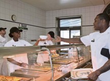 Photo by Elizabeth BehringPvt. Kirsten Hazel, culinary food specialist, hands a bowl of spaghetti to Pfc. Terrance Gaddy, also a culinary food specialist, during lunch at the Hard Rock Diner dining facility on Smith Barracks in Baumholder. The Hard Rock Diner recently won runner-up at the Department of the Army-level Phillip A. Connelly Awards and Best in Europe for fiscal year 2014.