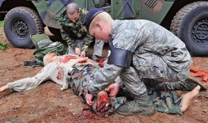 Members of the 569th U.S. Forces Police Squadron and 86th Medical Group practice life-saving techniques during a training exercise May 30 on Ramstein.