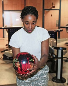 Staff Sgt. Tiara Jenkins, a certified occupational therapy assistant with the 254th Medical Detachment, Combat Operational and Stress Control, 21st Theater Sustainment Command, prepares to throw a ball down the lane at the Vogelweh Bowling Center. Jenkins represented the Army women’s bowling team at this year’s Armed Forces Bowling Championship held in May at Joint Base Lewis-McChord. Competing against bowlers from the Navy and Air Force, Jenkins and her three teammates bested the field, taking the gold.