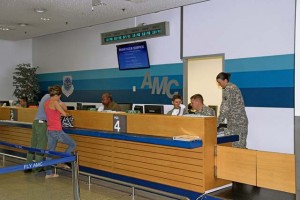 Spc. Alexander Kennedy (near center) and Sgt. Julie Chrisman (near right), transportation management coordinators with the 7th Civil Support Command’s 1177th Movement Control Team, Kaiserslautern, receive training in passenger terminal operations from a 721st Aerial Port Squadron Airman as part of pre-deployment training and validation in air operations July 30 on Ramstein. 