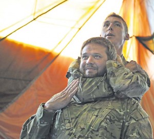 Staff Sgt. Josh Krape (top), 86th Operations Support Squadron survival, evasion, resistance and escape specialist, demonstrates proper blood choke techniques.