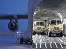 Members of the 212th Combat Support Hospital drive three Medium Tactical Vehicles 
loaded with part of their 12-bed Early Entry Package onto a C-17 March 11 on Ramstein. Medics using the EEP are capable of treating a dozen service members in any field environment worldwide.
