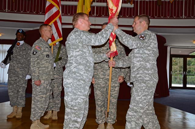 Outgoing U.S. Army Garrison Kaiserslautern commander Lt. Col. Lars Zetterstrom relinquishes command to Col. Bryan D. DeCoster during a ceremony June 28 at Armstrong’s Club on Vogelweh. Zetterstrom was the last battalion level garrison commander for USAG Kaiserslautern before its scheduled inactivation in September.