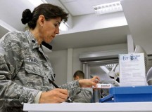Lt. Col. Christine Fairley, 86th Medical Support Squadron diagnostic and therapeutic flight commander, prepares medicine for a KMC resident 
getting medication through the Self-Initiated Care Kit program Sept. 13 on Ramstein. The objective of the S.I.C.K. program is to honor families’ time and resources by reducing appointments for over-the-counter medications.