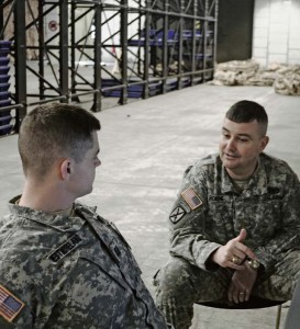 Maj. John Roache, operations officer with Headquarters and Headquarters Battery, 263rd Army Air and Missile Defense Command, discusses ballistic missile defense operations with Capt. William Westmoreland, operations officer with the 263rd, during a training exercise March 6.