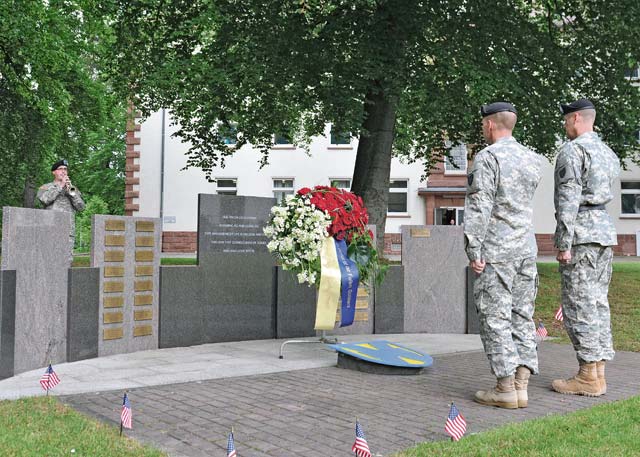 Photo by Staff Sgt. Warren W. Wright Jr.Maj. Gen. John R. O’Connor and Command Sgt. Maj. Rodney J. Rhoades, commanding general and senior enlisted adviser of the 21st Theater Sustainment Command, render a salute honoring Soldiers of the 21st TSC who have given their lives in the service of their nation during a Memorial Day wreath laying ceremony May 22 on Panzer Kaserne.