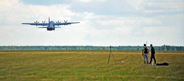 A U.S. Air Force C-130J Super Hercules from Ramstein takes off from a grass landing strip on Powidz Air Base, Poland, July 11. Airmen from the 86th Airlift Wing are located in Poland for a forward training deployments employing training events with NATO allies, demonstrating shared commitments to peace.  