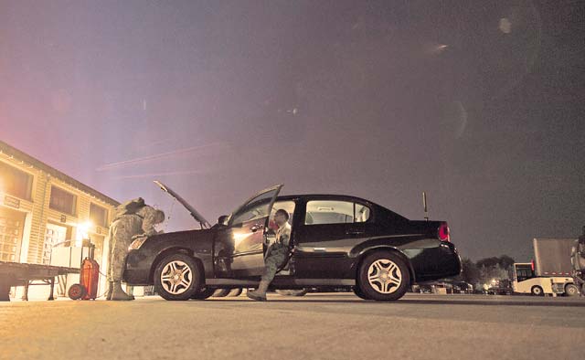 Photo by Senior Airman Damon KasbergMembers of the 86th Vehicle Readiness Squadron inspect a government vehicle.