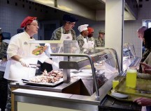 Brig. Gen. Patrick X. Mordente, 86th Airlift Wing commander, serves turkey to KMC members on Thanksgiving Day at the Rheinland Inn Dining Facility. Mordente and several other leaders 
volunteered to help serve a Thanksgiving meal for KMC Airmen and their families.