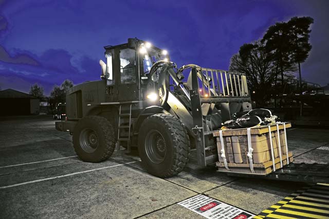 Staff Sgt. Brantley Roberson, 86th Logistics Readiness Squadron aerial delivery technician, prepares to move a container Dec. 15 that was specifically built for Santa Claus to deliver toys to children. After being loaded, the bundles will be air-dropped at U.S. Army Garrison Baumholder along with Santa so that he can deliver them to local families in need of a little support this holiday season.