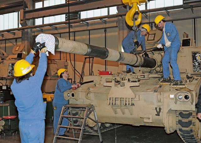 Members of the Theater Logistic Support Center-Europe’s Maintenance Activity Vilseck remove the tube from an M-109A6 Howitzer Jan. 16  on Rose Barracks. The MAV, along with the Army Field Support Battalion-Germany, the 16th Sustainment Brigade’s 317th Maintenance  Company, and the U.S. Army Tank Automotive and Armament Command, have been tasked with the replacement of the tubes on eight European Activity Set Howitzers ensuring they are mission ready for upcoming rotations of American forces to Europe as part of the U.S. Army’s  European Rotational Force.