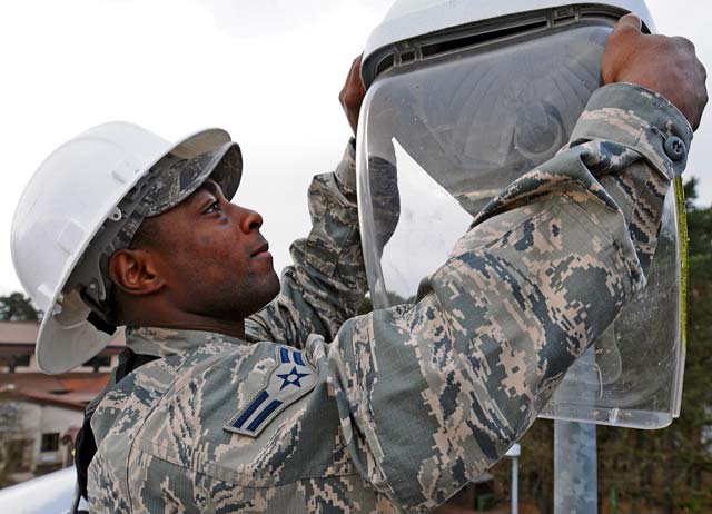 Airman 1st Class Rashad Spann, 786th Civil Engineer Squadron electrical technician, repairs a street light Feb. 20 on Ramstein. Spann is one of many first-term Airmen who use the core values during their day-to-day tasks so they can excel in their careers.