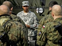 U.S. Army Sgt. 1st Class Charles Odom from the 16th Sustainment Brigade conducts a class on vehicle shipment preparation and U.S. customs inspections to prepare soldiers from the Polish Land Forces 10th Logistics Brigade for their deployment to Afghanistan.