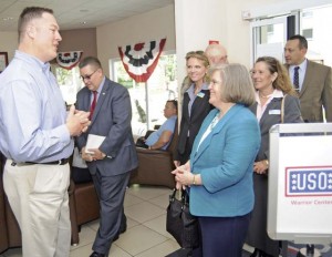 Photo by Phil A. JonesKonrad Braun, director of USO Kaiserslautern, greets Holly Petraeus, assistant director of the Consumer Financial Protection Bureau Service Member Affairs, at her May 16 arrival at the USO Warrior Center at Landstuhl Regional Medical Center.