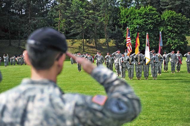 Col. Koji D. Nishimura, outgoing commander of the 21st Theater Sustainment Command’s 30th Medical Brigade, salutes his Soldiers one last time during a change of command ceremony May 21 on Sembach Kaserne.