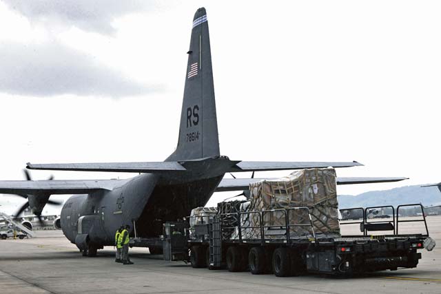Airmen from the 721st Aerial Port Squadron and the 37th Airlift Squadron work together to load mobility assets onto a C-130J Super Hercules Sept. 17 on Ramstein.