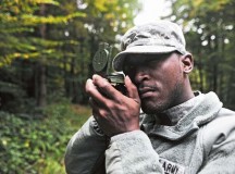 Spc. Billy L. Phillips, a human resources specialist assigned to the 21st Theater Sustainment Command’s 1st Human Resources Sustainment Command, checks his azimuth during land navigation training.