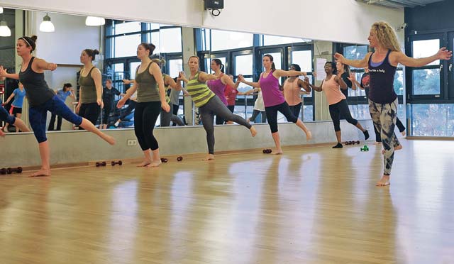 During De-Stress Day at the Ramstein Southside Fitness Center, fitness teacher Teresa Romanowicz shows class participants how to dance to various types of music to de-stress in a healthy way before the busy holiday season.