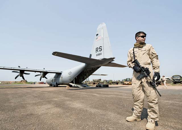 Airman 1st Class Andrew Bracamontes, Ramstein Fly Away Security Team member, stands guard over a C-130J Super Hercules in Central African Republic. F.A.S.T. members are specially trained and equipped security forces personnel deployed to provide security for aircrew and aircraft while stopped in high-threat areas around the globe.