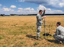 Master Sgt. Stanley MacDonald, 435th AGOW’s AMS air traffic controller, and Staff Sgt. Brock Neel, 435th AMS engineer, survey an area for training with a dynamic cone penetrometer July 11 at Powidz Air Base, Poland. The measure-
ment from the DCP is one of the steps in determining if an airfield is safe for an aircraft landing.