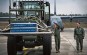Airman 1st Class Dylan Arnt (center), 37th Airlift Squadron loadmaster, directs an Airman as she drives a forklift with cargo onto a C-130J Super Hercules.