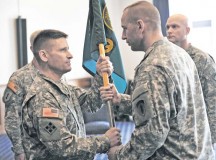 Photo by Staff Sgt. Alexander A. BurnettCol. Steven L. Hite (left), outgoing 19th Battlefield Coordination Detachment commander, accepts the organization’s colors from Sgt. Maj. Richard E. Larson, 19th BCD sergeant major, during a change of command ceremony June 18 at the Ramstein Officers’ Club.