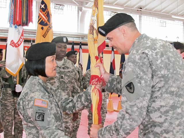Courtesy photoCol. William Bailey (right), 409th Contracting Support Brigade  commander, passes the colors to Lt. Col. Daryl (Gwen) Devera-Waden,  903rd Contingency Contracting Battalion incoming commander, during a change of command ceremony June 20 in Kaiserslautern. Devera-Waden took command from Lt. Col. Lynda Royse, who relinquished command of the the 903rd CCBn. after three years of continuous leadership. Royse’s next assignment will be at the Pentagon where she will be working as part of the joint staff.