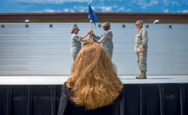 Teresa Bracher, 86th Airlift Wing chief of protocol, watches a change of  command dry-run July 17 on Ramstein. The wing protocol office is made up of a four-man team that provides support to approximately 22,000 military members and Department of Defense civilians.