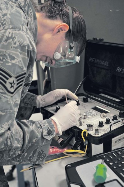  Photo by Senior Airman Timothy Moore  Staff Sgt. Amy Smith, 86th Maintenance Squadron Precision Measurement Equipment Laboratory technician, cleans the connectors on a fuel quantity test set July 30 on Ramstein. As the largest PMEL in the Air Force, the shop supports more than 400 work centers under the U.S. Africa Command, U.S. Central Command, U.S. European Command and the U.S. Transportation Command by calibrating 14,000 items that require quantitative measurements.
