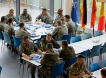 Airmen from different nations dine at the International Dining Facility at Headquarters Allied Air Command Aug. 13 on Ramstein. Until recently, an escort was required along with several days of processing time to dine at the facility. The change came after a desire was expressed to offer a new dining facility and a multinational experience.