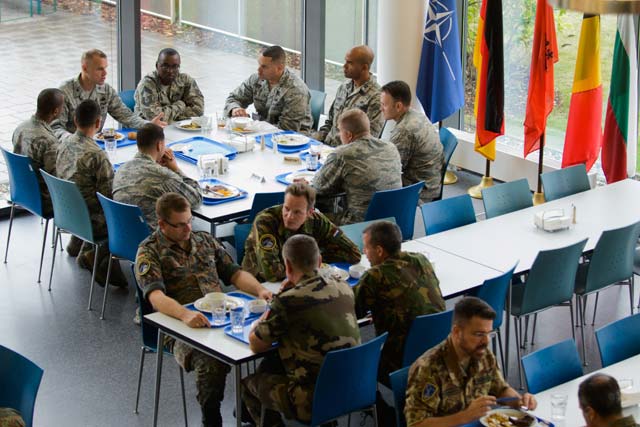 Airmen from different nations dine at the International Dining Facility at Headquarters Allied Air Command Aug. 13 on Ramstein. Until recently, an escort was required along with several days of processing time to dine at the facility. The change came after a desire was expressed to offer a new dining facility and a multinational experience.