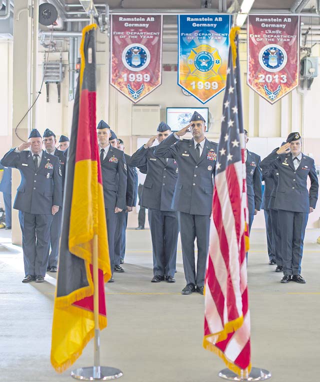 Photo by Senior Airman Damon KasbergMembers of Team Ramstein render a salute during a 9/11 ceremony Sept. 11 at Fire Station One on Ramstein. The ceremony was held to honor the first responders who died at the World Trade Center 13 years ago.