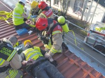 U.S. Army Garrison Rheinland-Pfalz firefighters treat simluated casualties on a rooftop at Kleber Kaserne in Kaiserslautern.