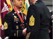 Photo by Sgt. 1st Class Alexander A. BurnettCommand Sgt. Maj. David Davenport Sr. (right), U.S. Army Europe command sergeant major, presents 1st Sgt. Anthony Forker Jr., Headquarters and Headquarters Company, 30th Medical Brigade first sergeant, with his Sergeant Morales Club medallion during an induction ceremony Jan. 7 at Armstrong’s Club on Vogelweh.