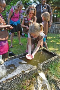 USA Girl Scouts Overseas play in the water during their field trip to the water treatment facility June 13 on Ramstein. The 786th Civil Engineer Squadron tests and purifies the drinking water for the KMC to ensure the distributed water is consumable for Airmen and civilians on base.