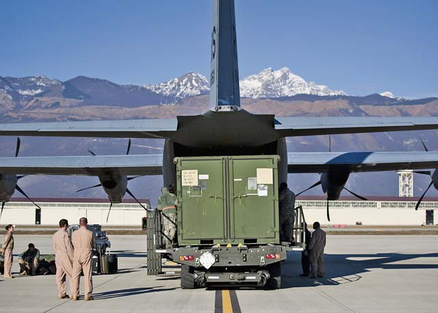 Airmen place cargo into a C-130J Super Hercules Dec. 17 on Aviano Air Base, Italy. Airmen from the 37th Airlift Squadron, along with several allied nations, delivered supplies and personnel to Central African Republic, Africa. 