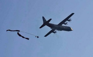 Photo by Staff Sgt. April TessmerA C-130J Hercules from the 37th Airlift Squadron completes a low-velocity air delivery system training mission June 18 over the Kirsten Drop Zone at the Baumholder Military Training Area. The joint training exercise demonstrated the ability to perform resupply and recovery operations in a foreign environment.