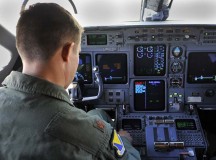 Maj. William Dabney, 86th Inspector General chief of wing readiness, sits in the pilot seat of a C-37A Gulfstream V checking to make sure everything is ready before a training flight Aug. 11 on Ramstein.