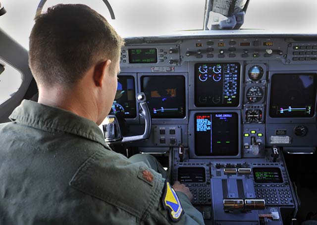 Maj. William Dabney, 86th Inspector General chief of wing readiness, sits in the pilot seat of a C-37A Gulfstream V checking to make sure everything is ready before a training flight Aug. 11 on Ramstein. 